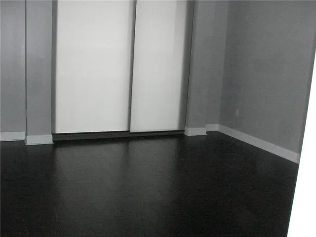 a view of a hardwood floor and a sink