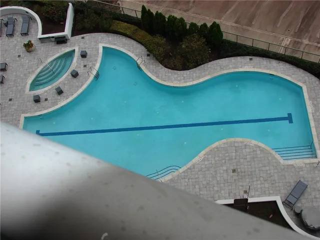 an aerial view of a house with a swimming pool