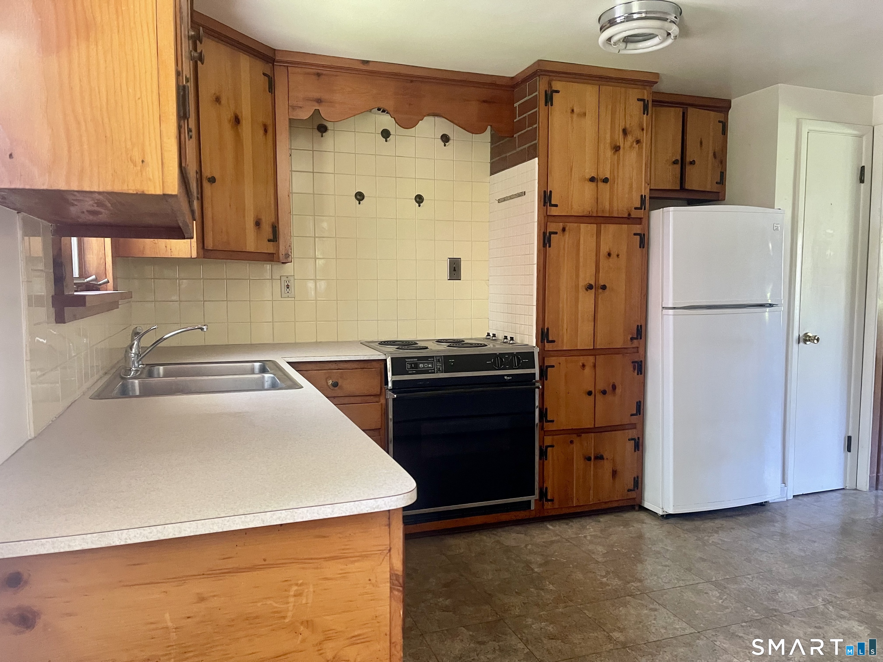 9 Apple Lane Redding, CT 06896 - Photo 12 of 39 At the top of the stairs is the Kitchen