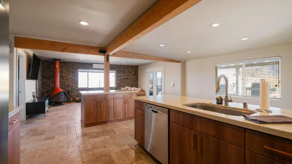 a kitchen with sink cabinets and window