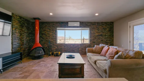 a living room with furniture and window
