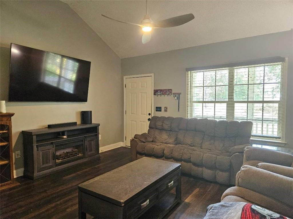 805 Gose Road Forsyth, GA 31029 - Photo 4 of 29 a living room with furniture and a flat screen tv