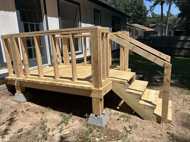 a view of house with backyard and deck