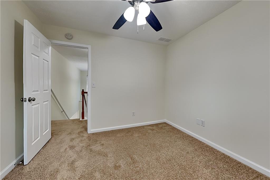 1595 Stephens Pond View Loganville, GA 30052 - Photo 12 of 22 wooden floor in an empty room
