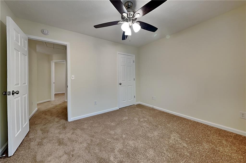 1595 Stephens Pond View Loganville, GA 30052 - Photo 15 of 22 an empty room with fan