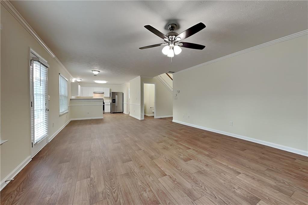 1595 Stephens Pond View Loganville, GA 30052 - Photo 3 of 22 a view of a big room with wooden floor closet and windows