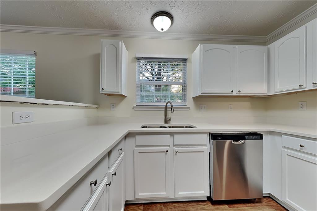 1595 Stephens Pond View Loganville, GA 30052 - Photo 4 of 22 a kitchen with cabinets and window