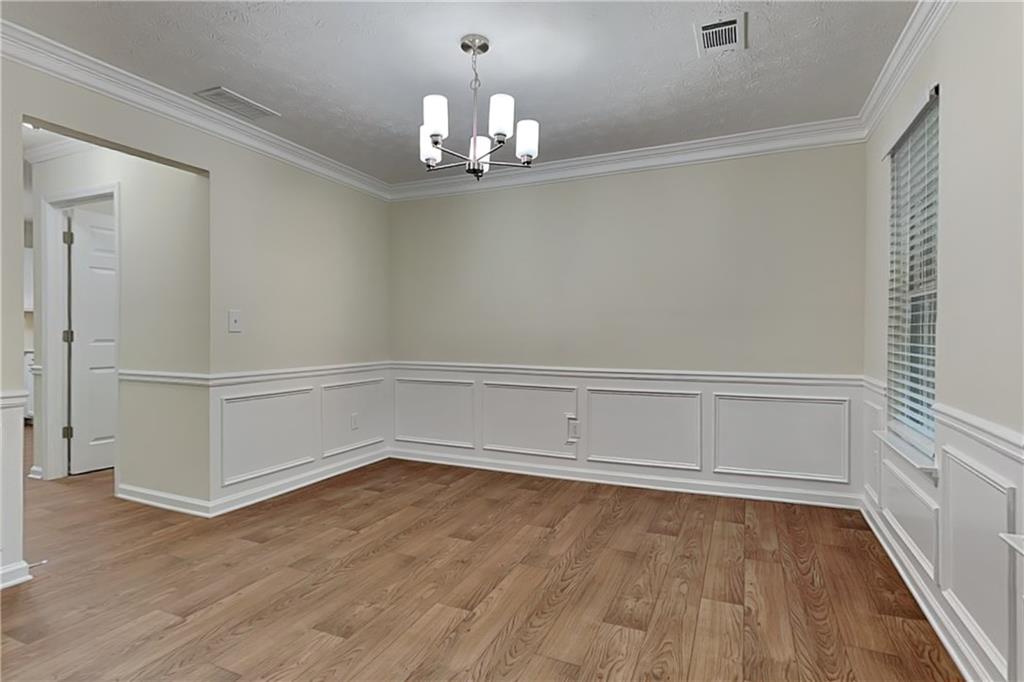 1595 Stephens Pond View Loganville, GA 30052 - Photo 7 of 22 a view of an empty room with a window