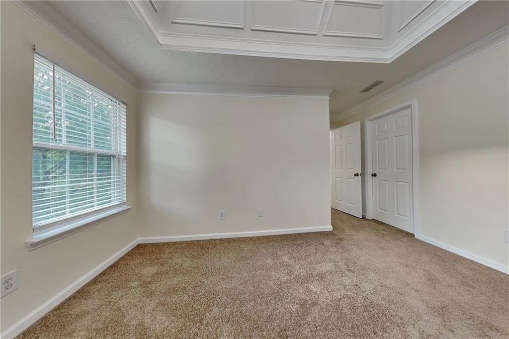 1595 Stephens Pond View Loganville, GA 30052 - Photo 8 of 22 a view of an empty room with a window