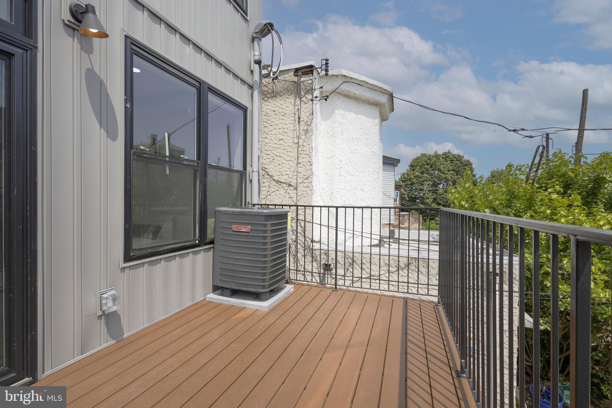 3116 Clifford Street, Unit B Philadelphia, PA 19121 - Photo 11 of 32 a balcony view with wooden floor