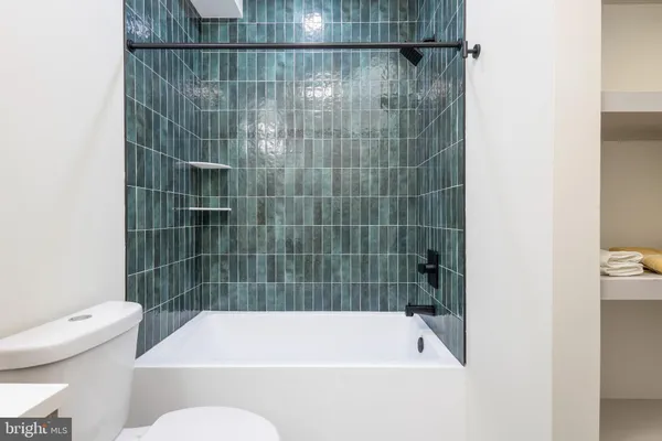 a bathroom with a bath tub