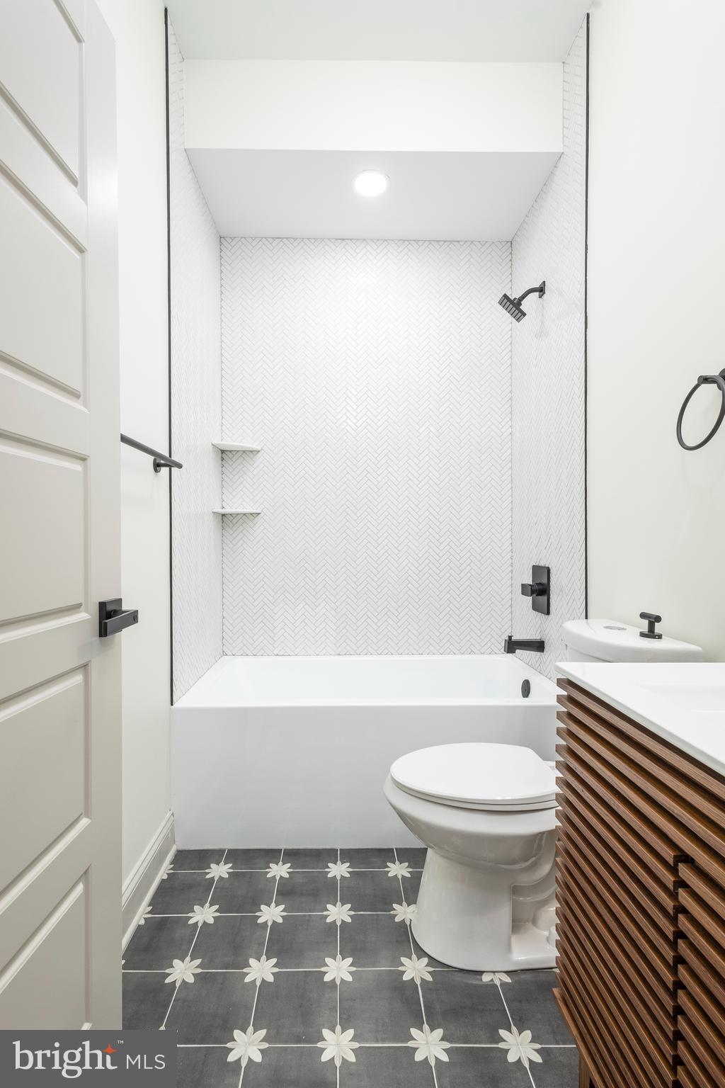 3116 Clifford Street, Unit B Philadelphia, PA 19121 - Photo 19 of 32 a bathroom with a toilet and a shower