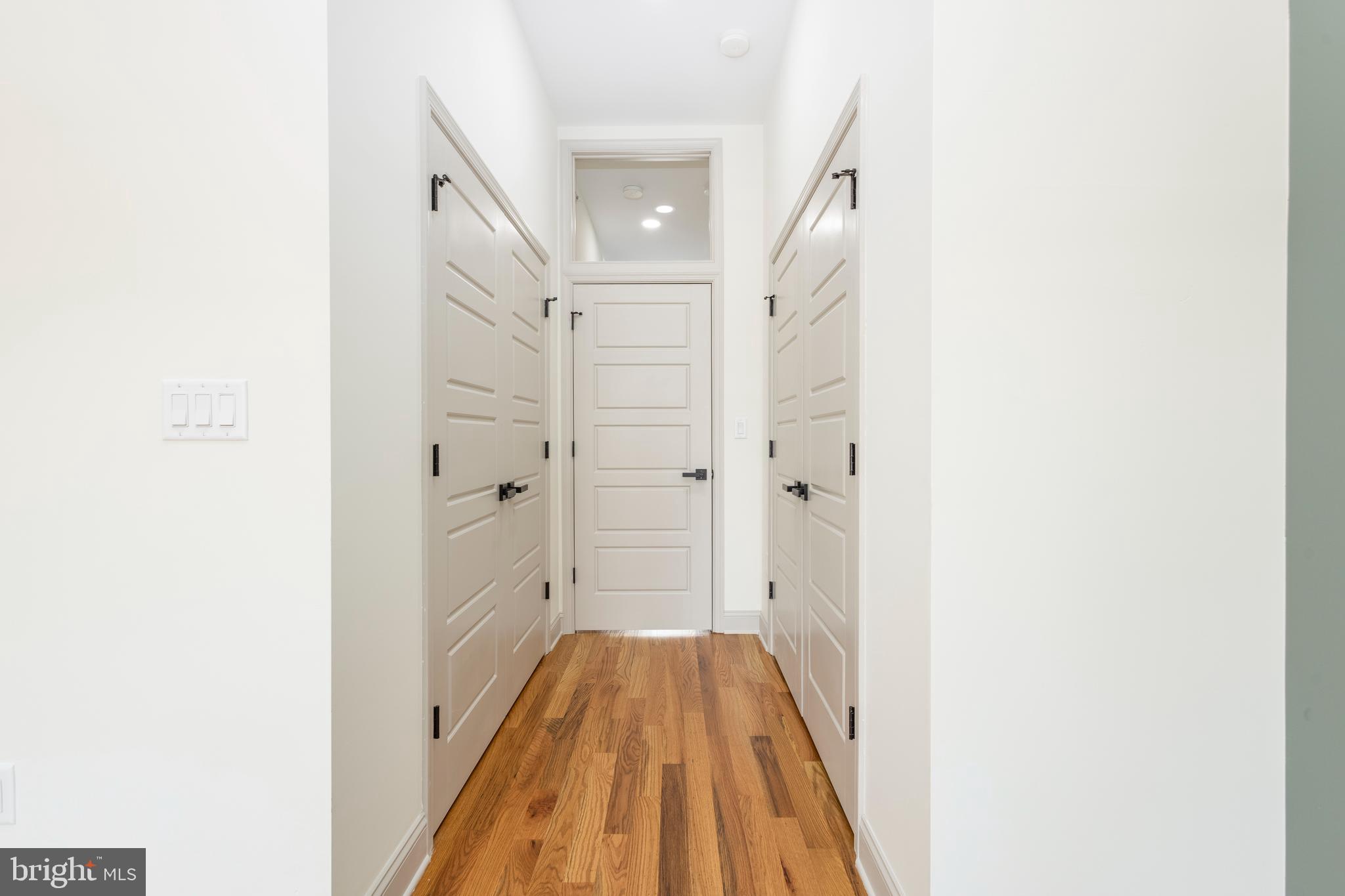 3116 Clifford Street, Unit B Philadelphia, PA 19121 - Photo 23 of 32 a view of a hallway with wooden floor and staircase