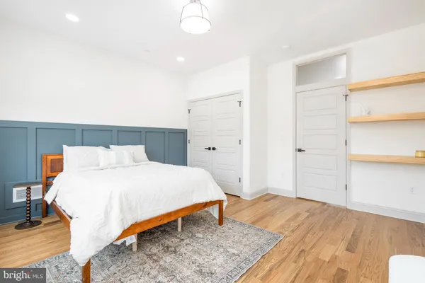 a bedroom with a bed and a table