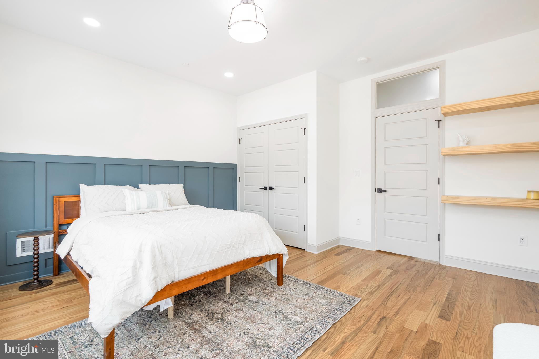 3116 Clifford Street, Unit B Philadelphia, PA 19121 - Photo 24 of 32 a bedroom with a bed and a table