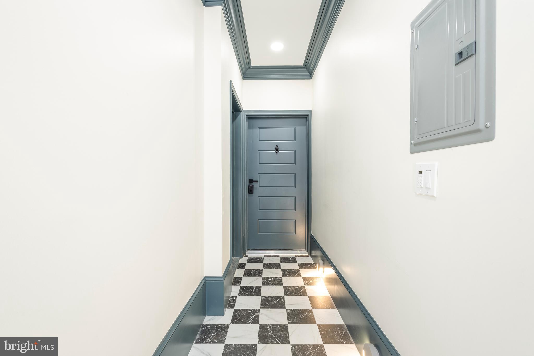 3116 Clifford Street, Unit B Philadelphia, PA 19121 - Photo 31 of 32 a bathroom with a black and white checkered floor