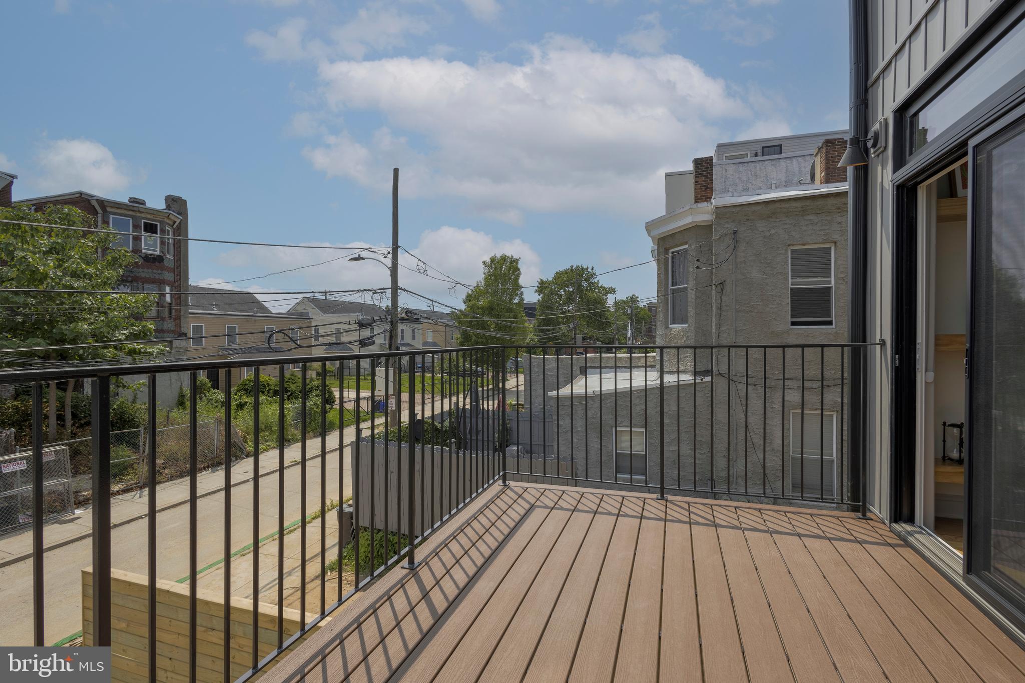 3116 Clifford Street, Unit B Philadelphia, PA 19121 - Photo 10 of 32 a view of a balcony with wooden floor