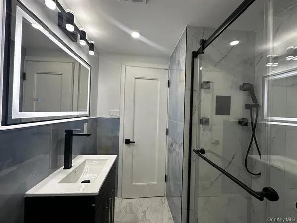 a bathroom with a sink and mirror