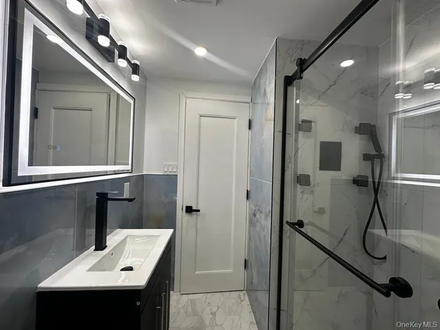 a bathroom with a sink and mirror