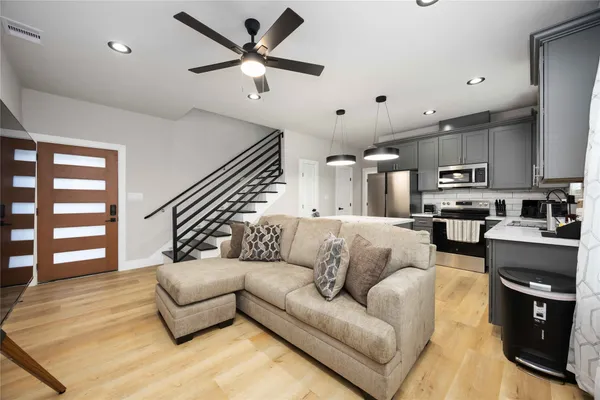 a view of entryway with wooden floor and stairs
