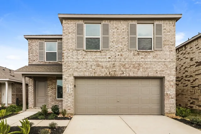 front view of a brick house with a window