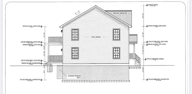 a black and white photo of a very nice looking living room