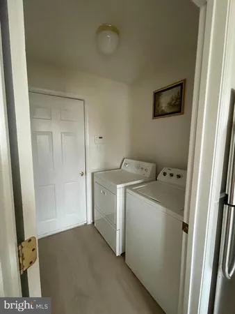 a view of storage and utility room with washer and dryer