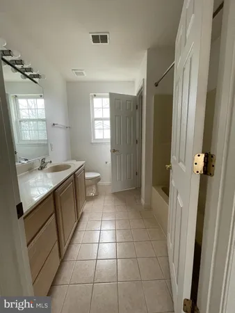 a bathroom with a sink a mirror and a shower