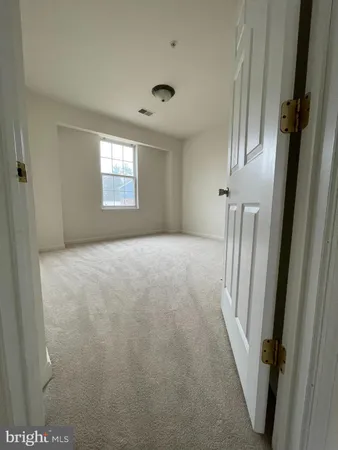 a view of hallway with windows