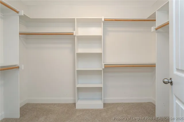 a view of an empty walk in closet
