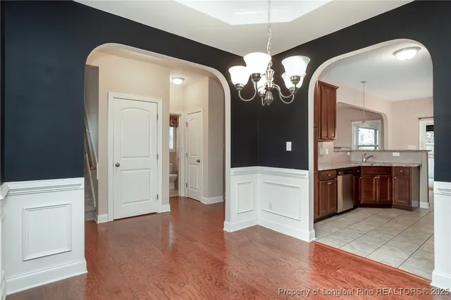 a view of a kitchen and a chandelier