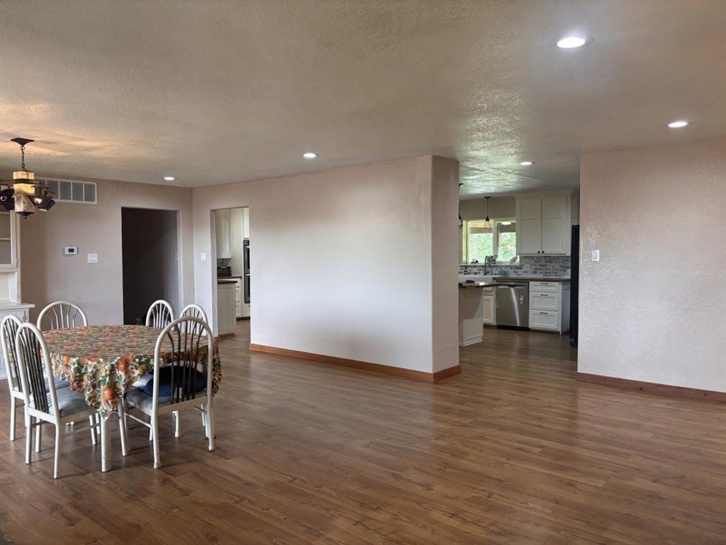 5355 Banks Road Fort Worth, TX 76140 - Photo 14 of 29 a view of a dining room with furniture and wooden floor