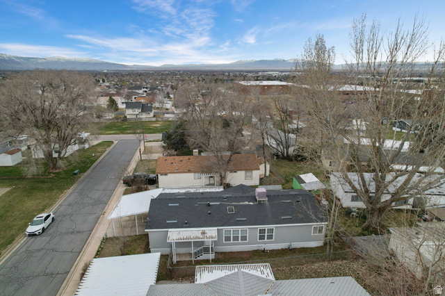 2600 North Hill Field Road, Unit 134 Layton, UT 84041 - Photo 33 of 41 Aerial perspective of suburban area featuring mountains