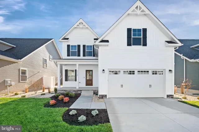 a view of house with yard