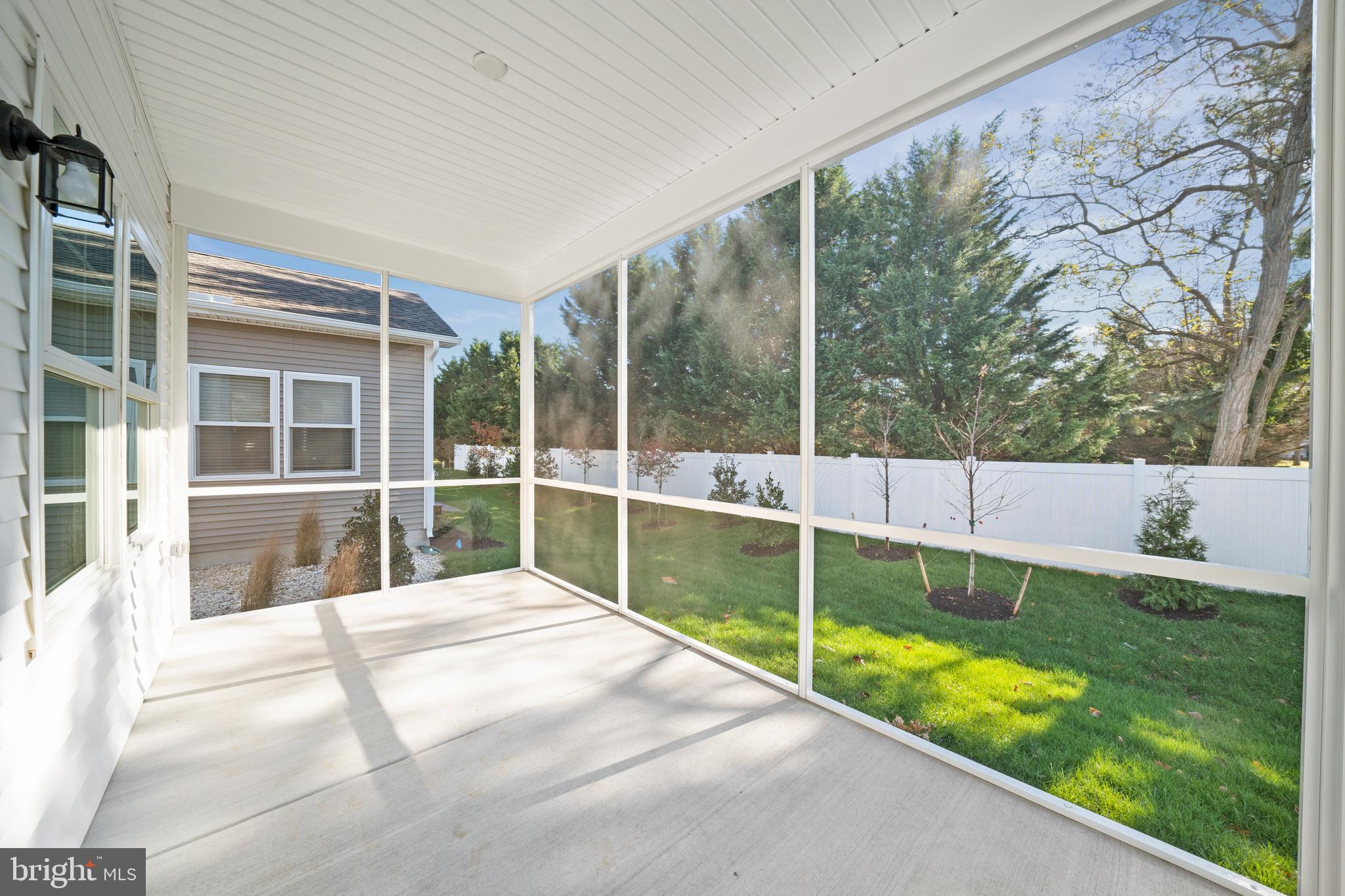 33766 Catching Cove Lewes, DE 19958 - Photo 17 of 47 a view of swimming pool with a yard and sitting area
