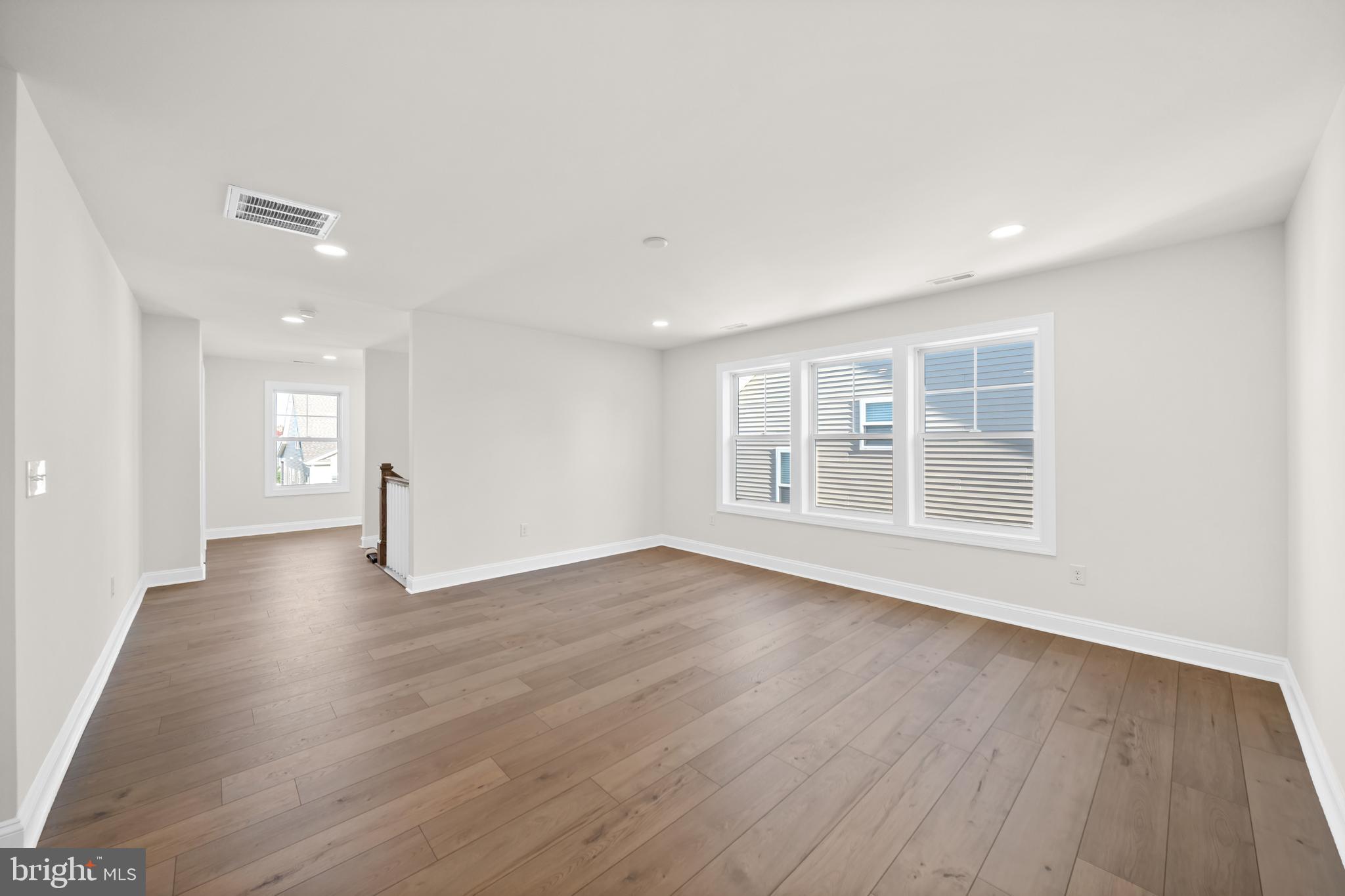33766 Catching Cove Lewes, DE 19958 - Photo 28 of 47 a view of an empty room with wooden floor and a window