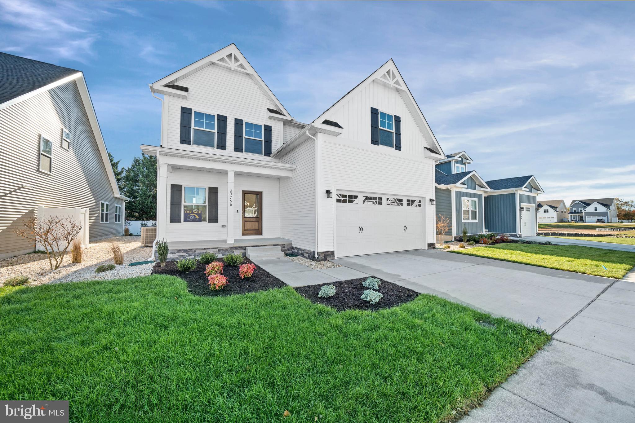 33766 Catching Cove Lewes, DE 19958 - Photo 3 of 47 a backyard of a house with seating space