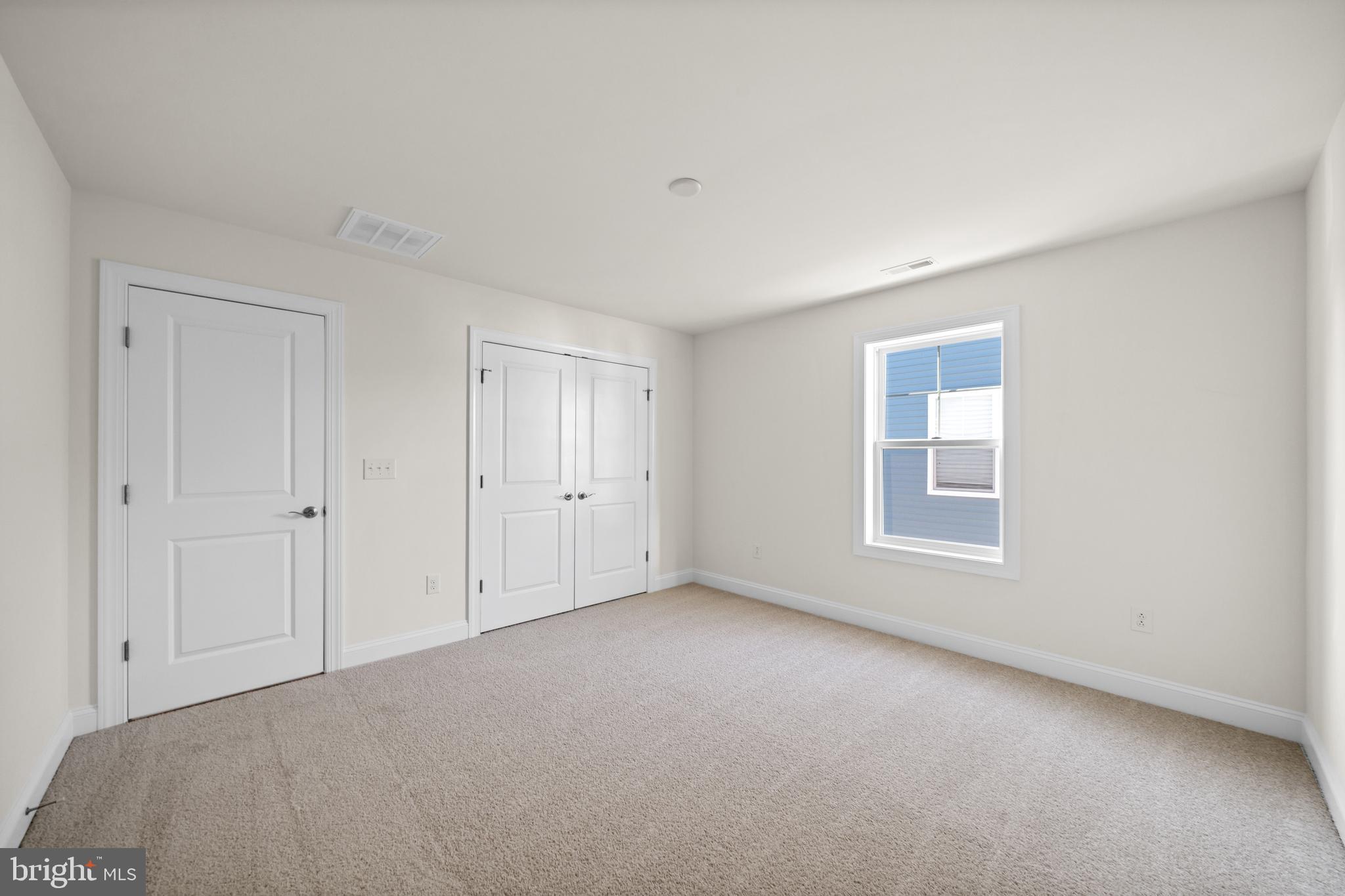 33766 Catching Cove Lewes, DE 19958 - Photo 32 of 47 a view of an empty room with a window