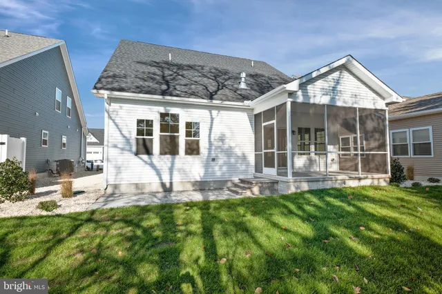 a view of a backyard with sitting area