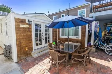 a view of balcony with furniture and umbrella