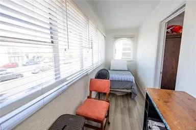 a bedroom with a bed and a mirror