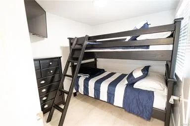 a kitchen with a sink a stove a refrigerator and cabinets