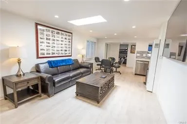 a bathroom with a sink a toilet and a window