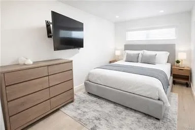 a patio with a table and chairs under an umbrella