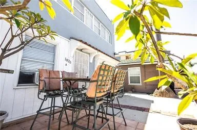 a view of a chair and table in the patio