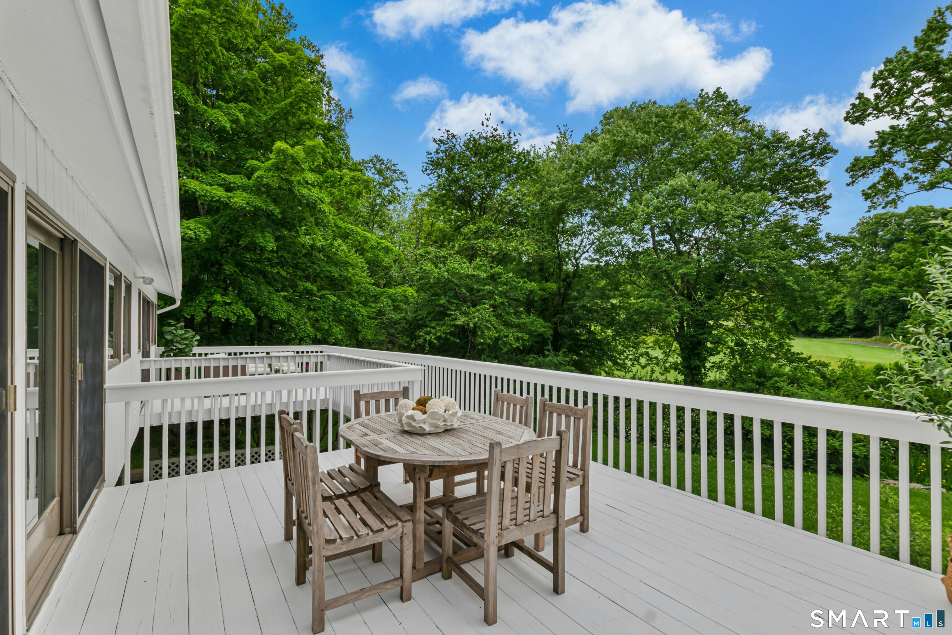 38 Old Redding Road Weston, CT 06883 - Photo 14 of 40 You can also enjoy meals outside while entertaining on this enormous deck with an additional seating area as well as a fire pit in the patio below.