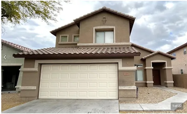 a front view of a house with a garage