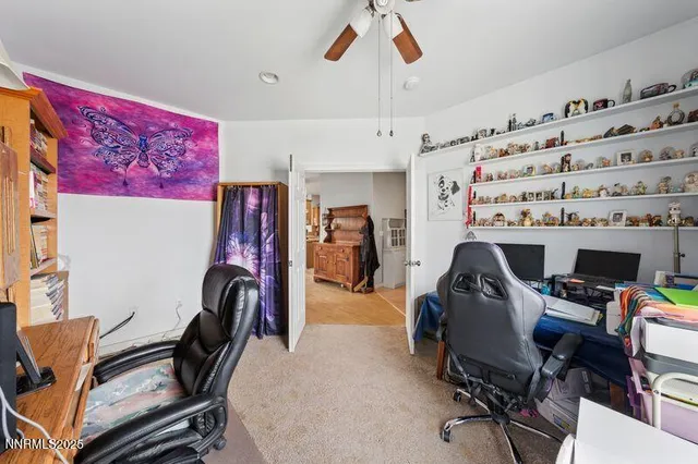 a bathroom with a sink a toilet and shower curtain
