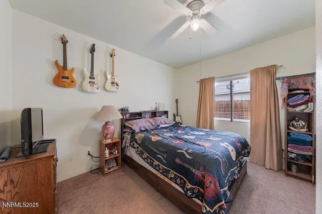 a view of a hallway with wooden floor and furniture