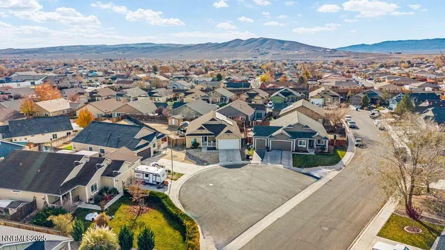 an aerial view of residential houses with outdoor space